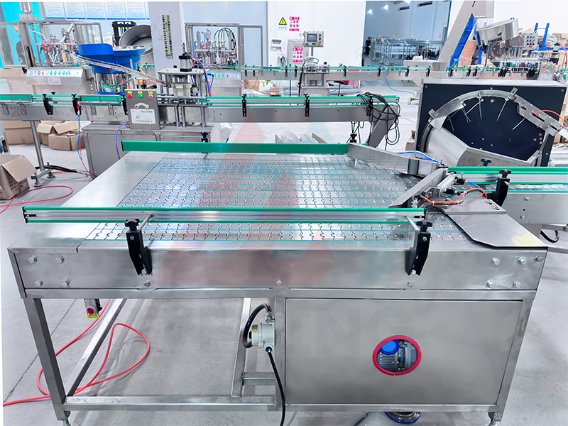 1. Alimentateur de canettes vides